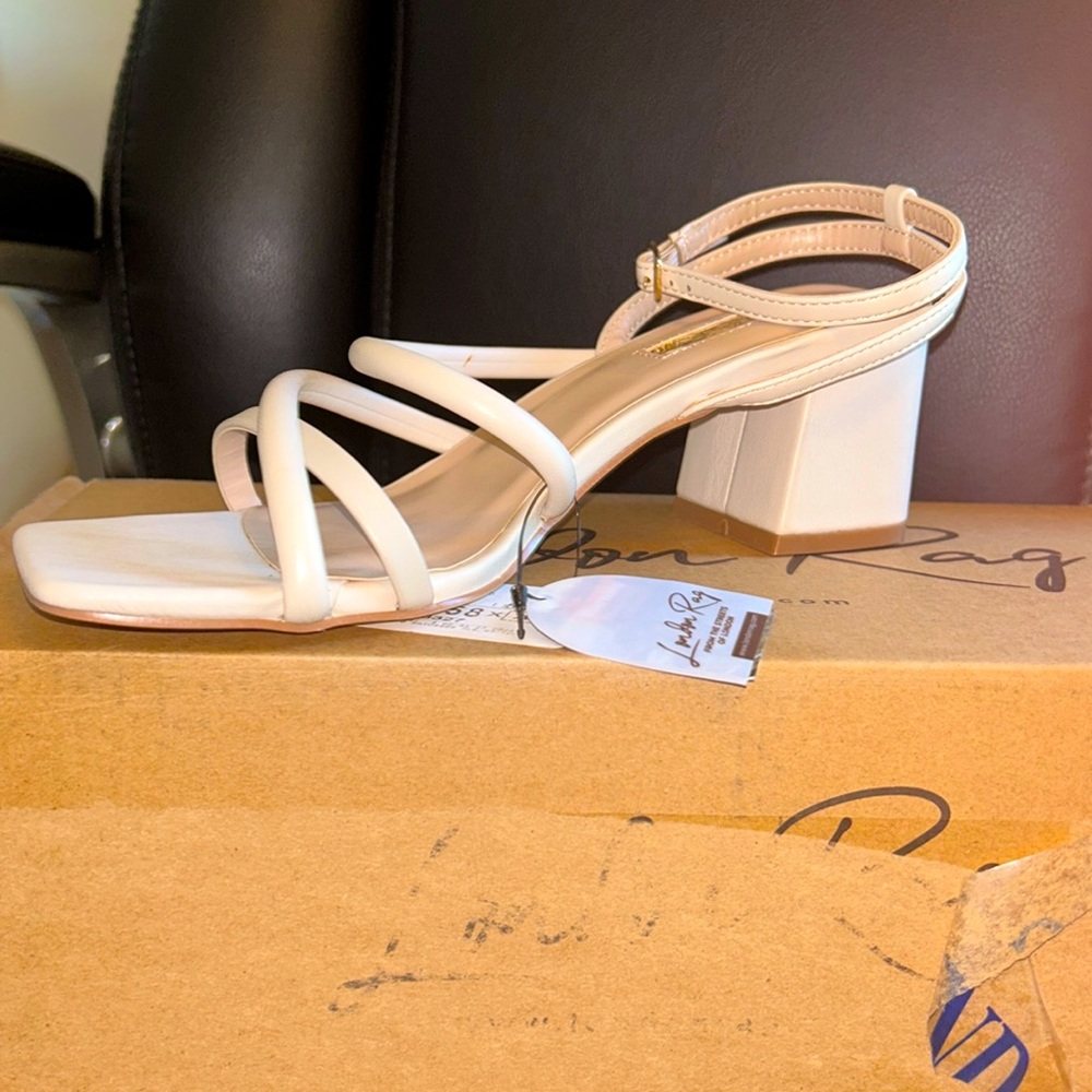 Sandle 3 strap block heel.  Size 7 2 inch heel. NWT